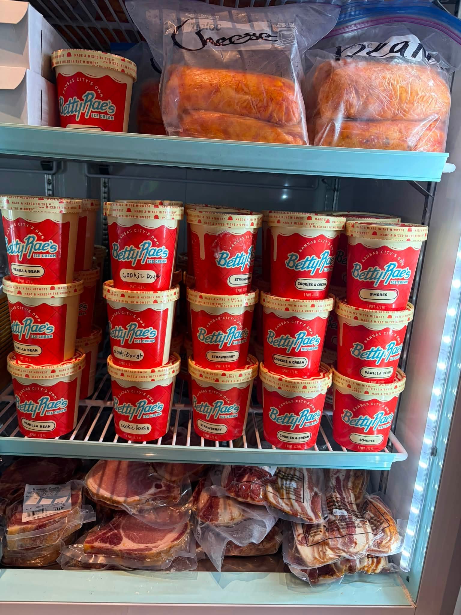 Freezer case with Betty Rae's Ice Cream and fresh-cut bacon